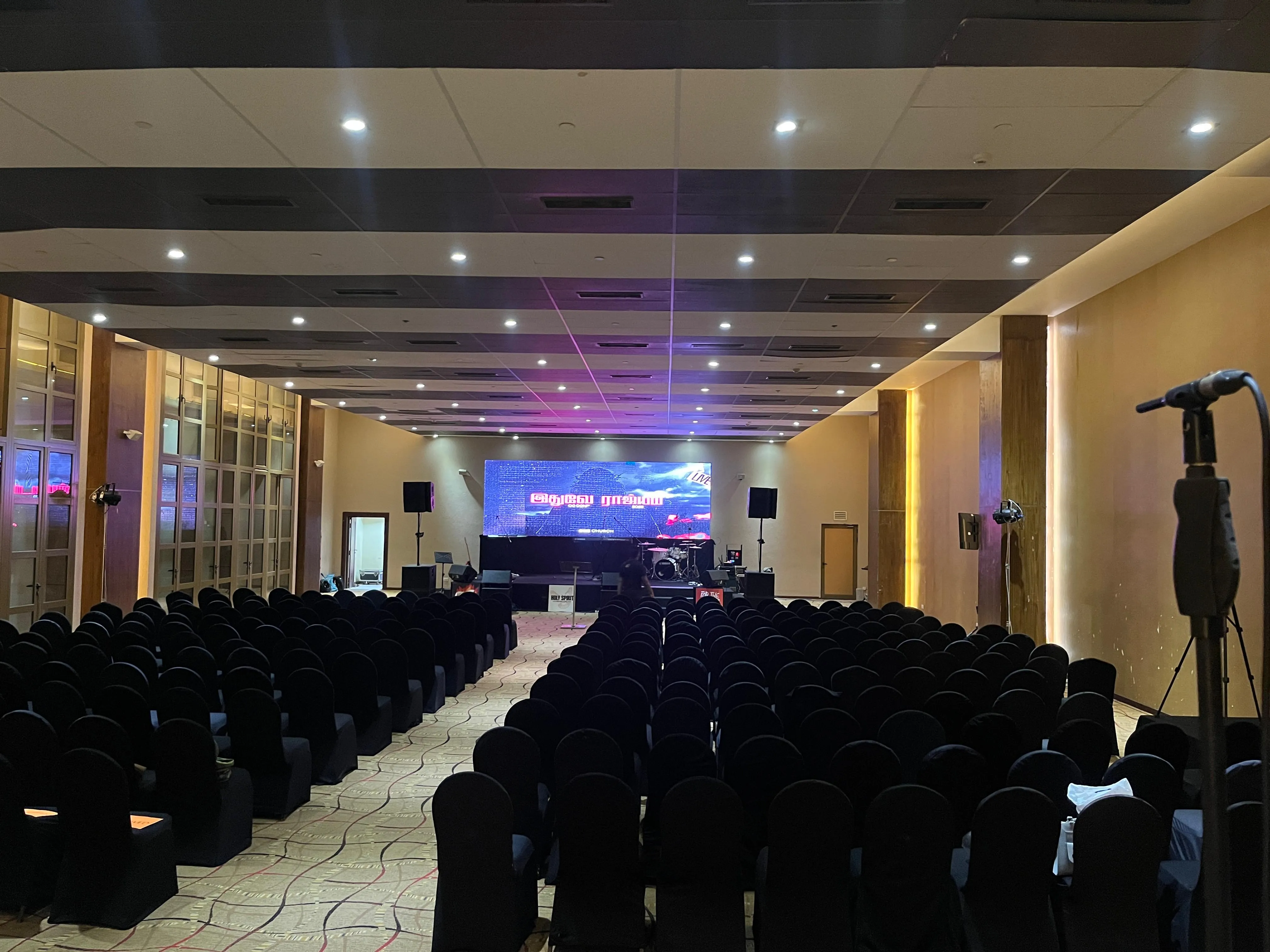 Live event audience with professional sound and stage lighting