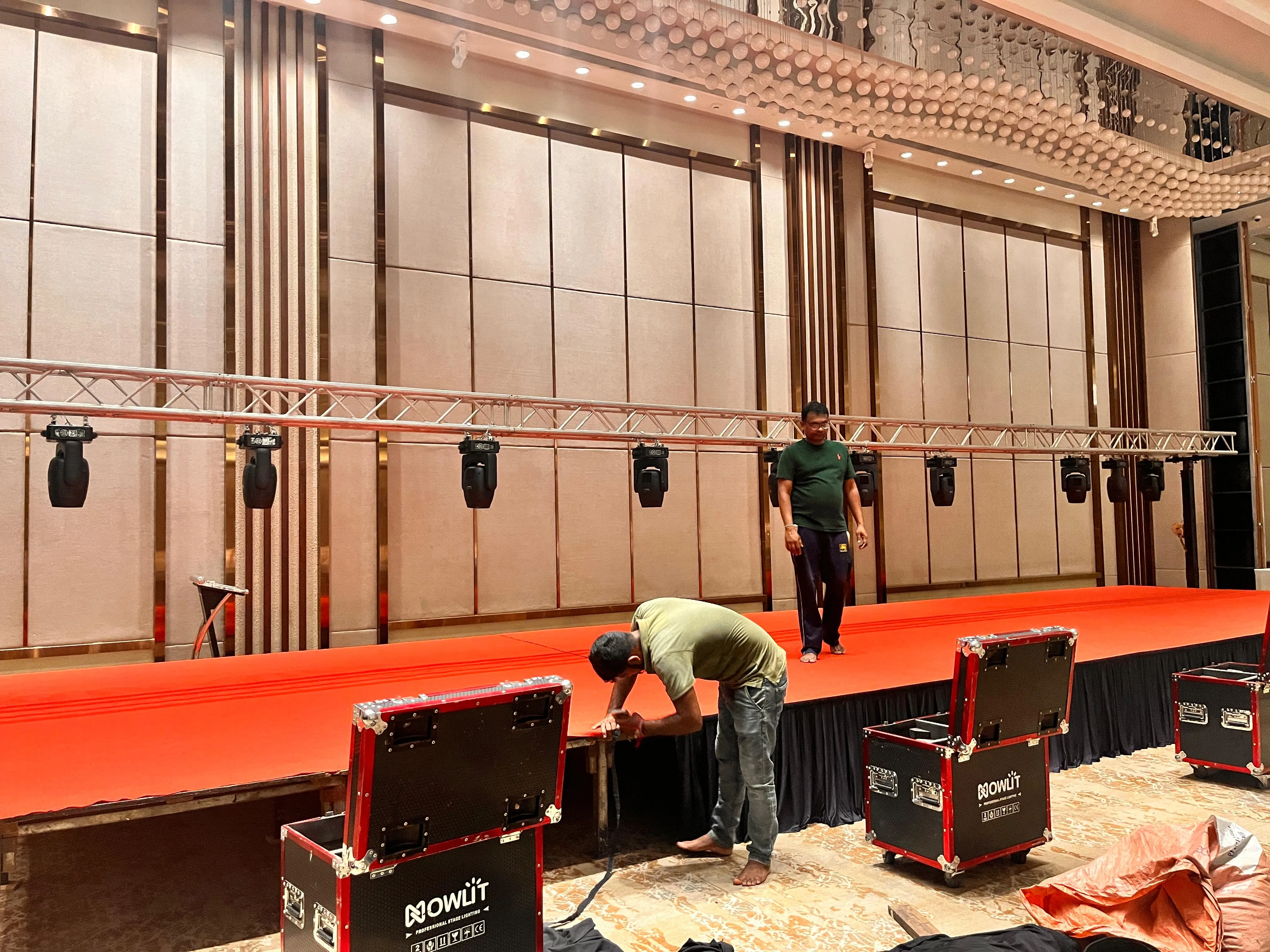 Crew installing a lighting truss on site