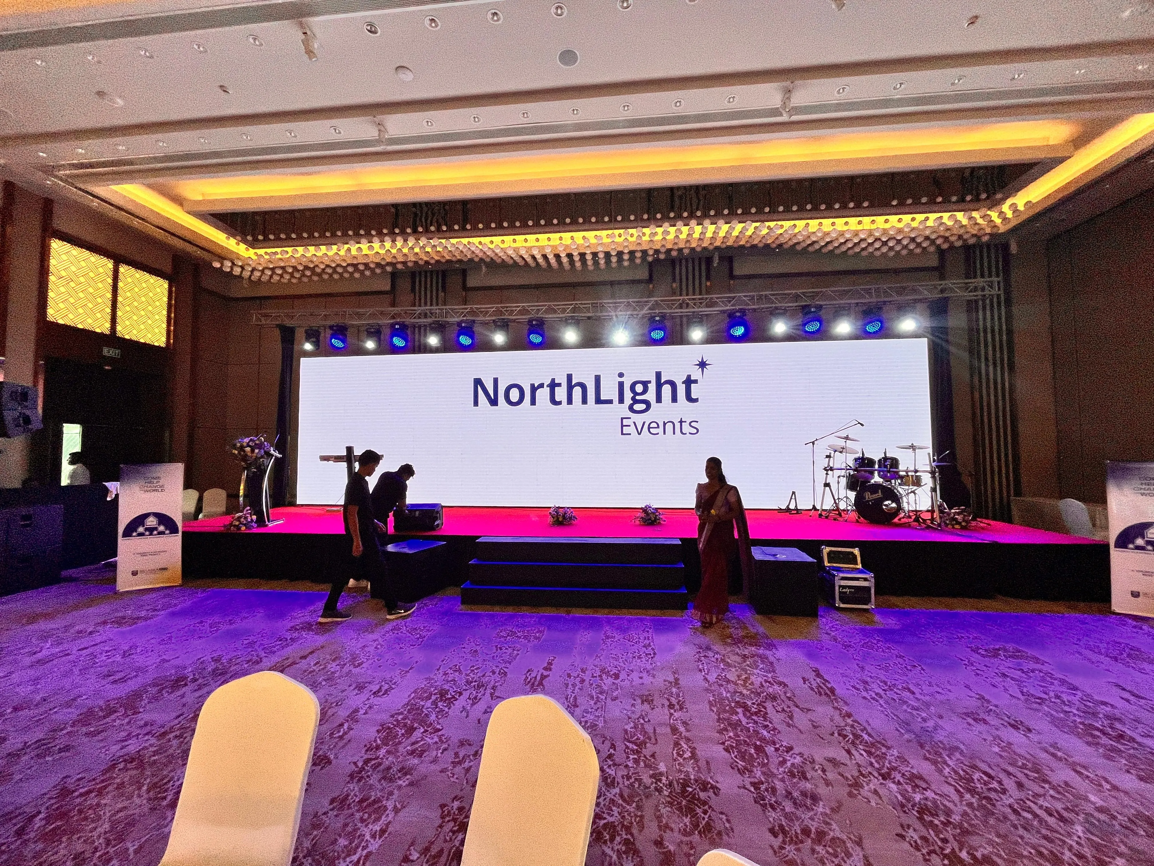 Formal corporate event with stage and event branding