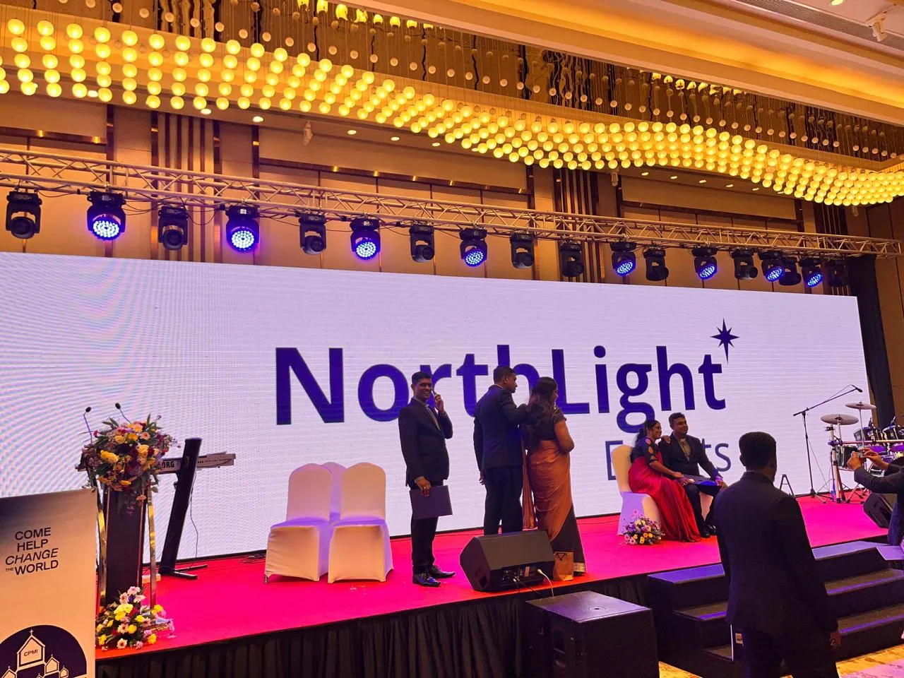 Gala dinner audience with stage and LED screen