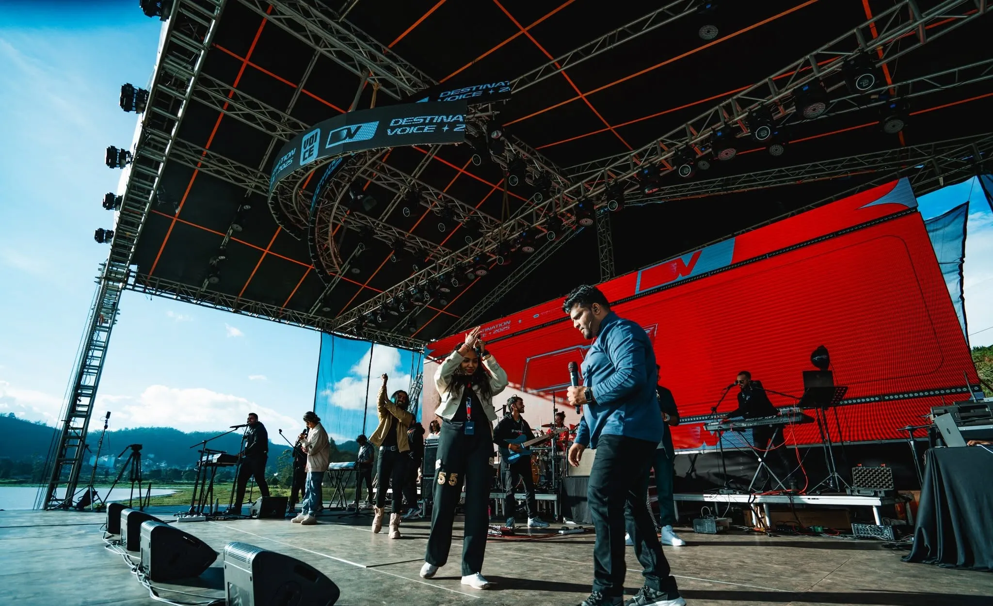 Outdoor festival stage with truss roof, lighting rig and LED wall